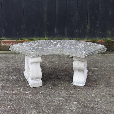 Lot 335 - A reconstituted stone garden bench