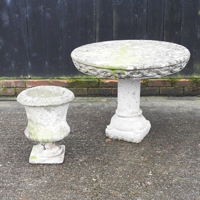 Lot 307 - A reconstituted stone garden table