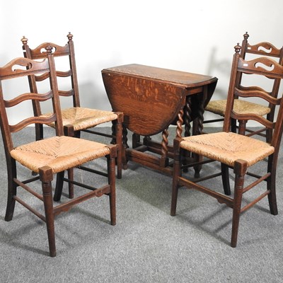 Lot 639 - A table and chairs