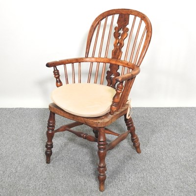 Lot 306 - A yew armchair