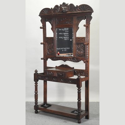 Lot 283 - A 19th century heavily carved dark oak hallstand