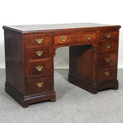 Lot 120 - A walnut desk