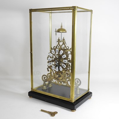Lot 174 - A brass skeleton clock