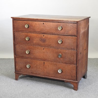 Lot 600 - A George III oak chest