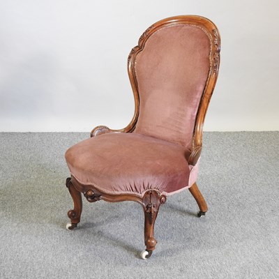 Lot 499 - A Victorian spoon back nursing chair