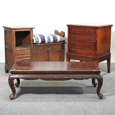 Lot 121 - A coffee table, seat and chest