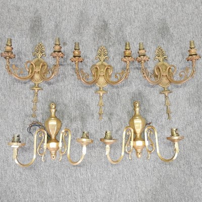 Lot 176 - A set of three gilt brass twin branch wall lights
