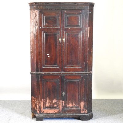 Lot 429 - A corner cabinet