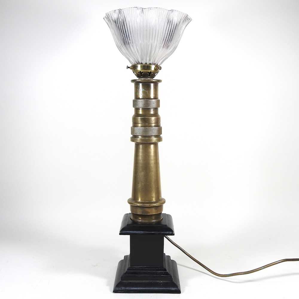 Lot 536 - A brass fireman's hose table lamp