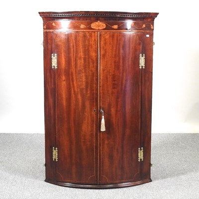 Lot 235 - A corner cupboard