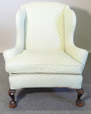 Lot 488 - A green wing chair