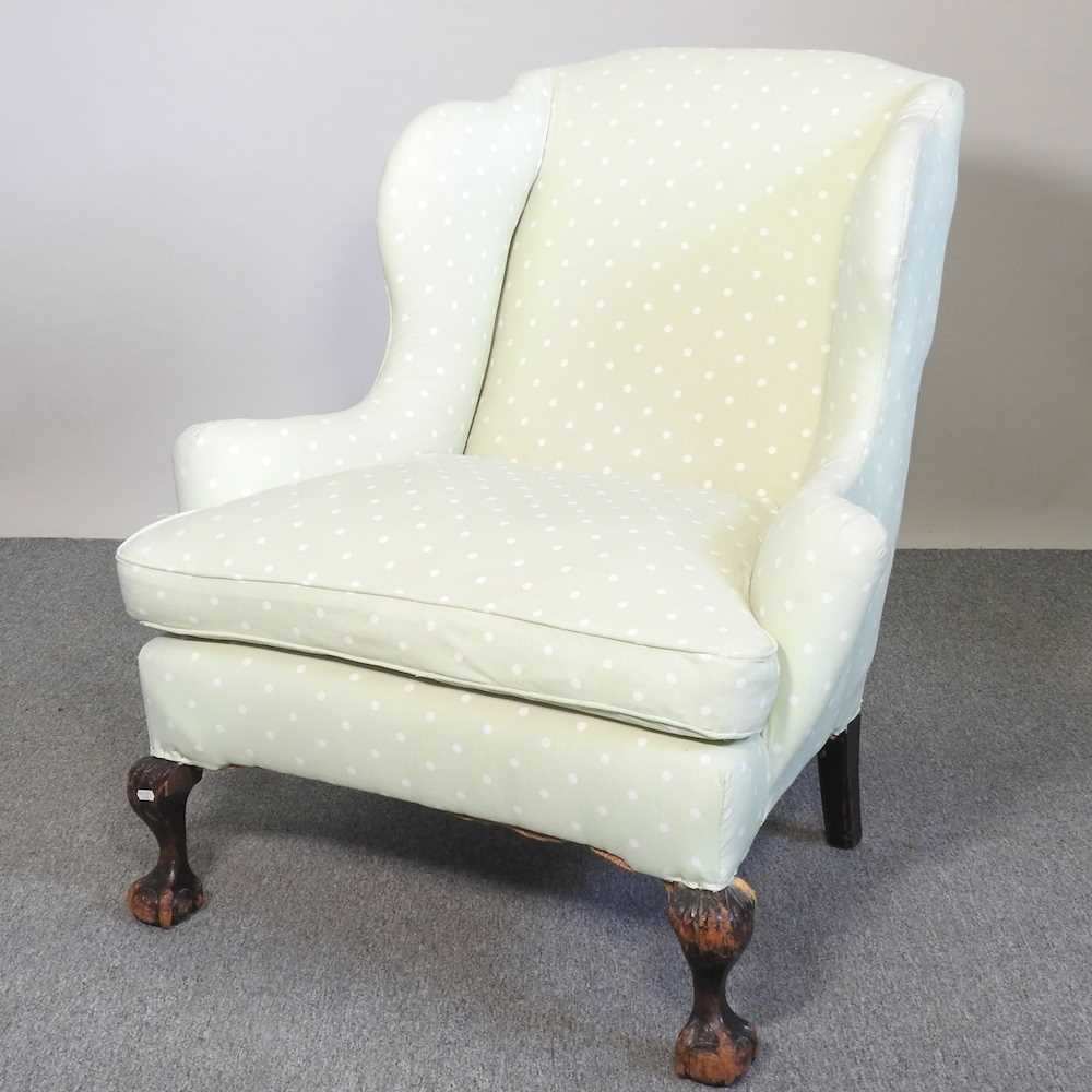 Lot 488 - A green wing chair