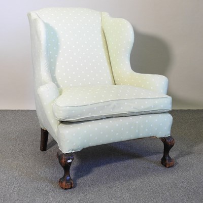 Lot 488 - A green wing chair