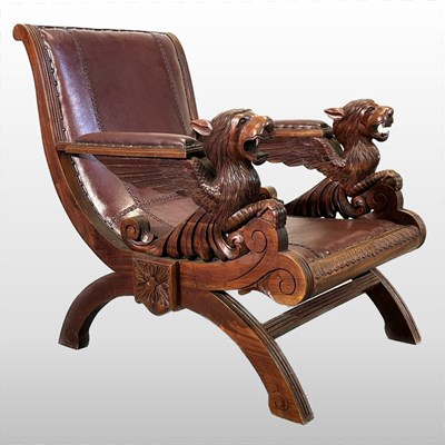 Lot 280 - A carved armchair