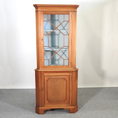 Lot 229 - A corner cabinet