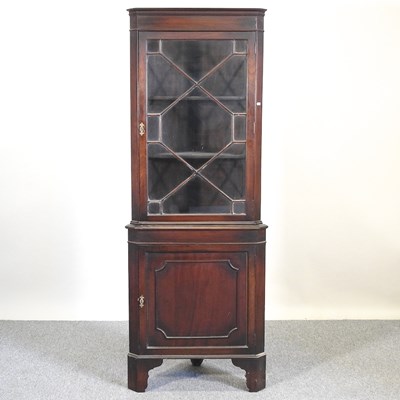 Lot 188 - A corner cupboard