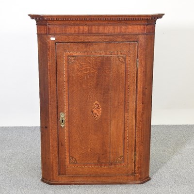 Lot 131 - A corner cupboard