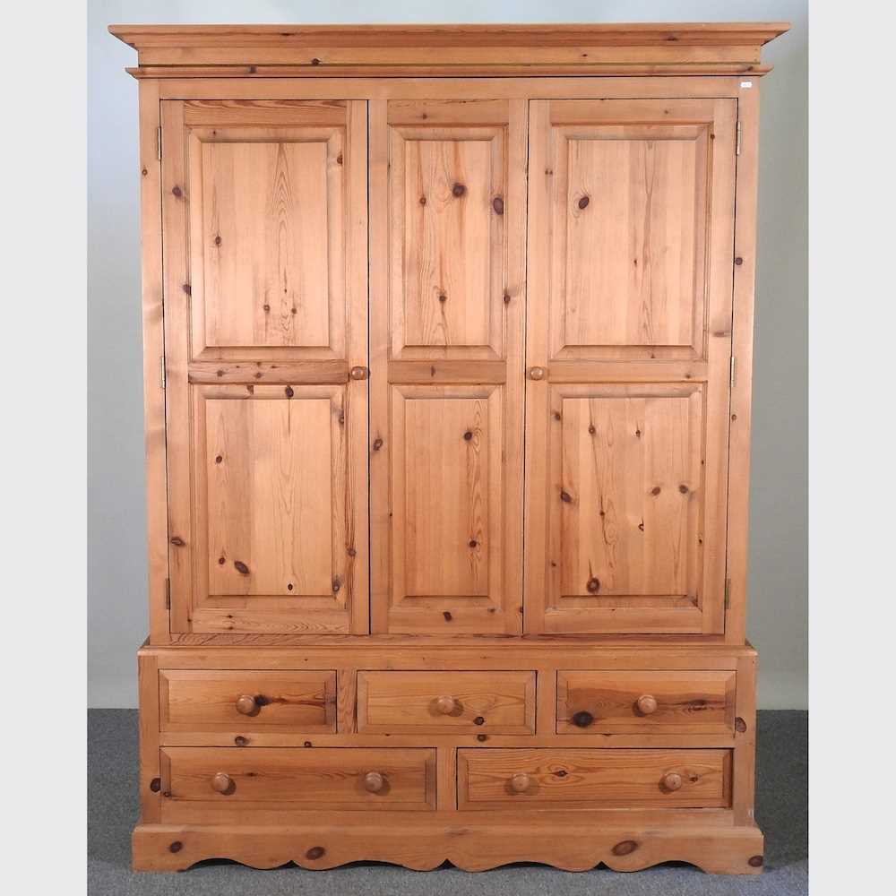 Lot 425 - A pine wardrobe