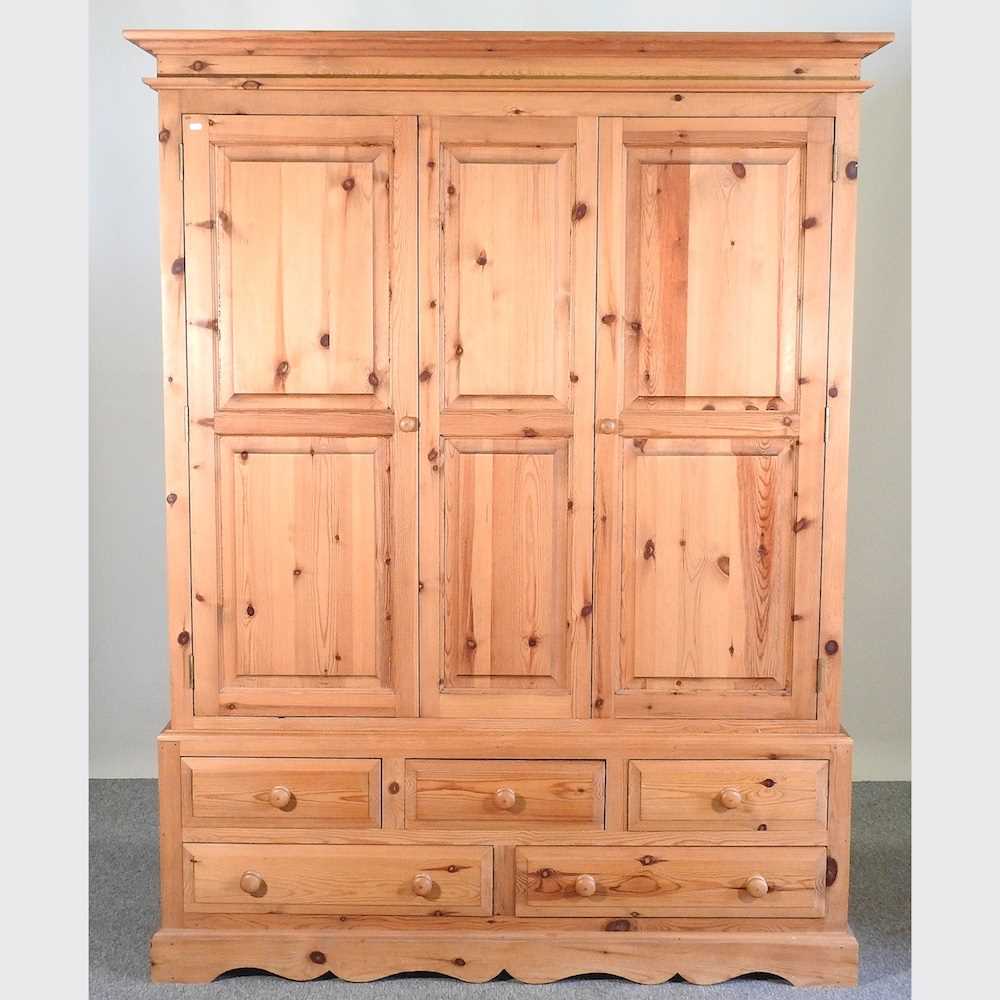 Lot 420 - A pine wardrobe