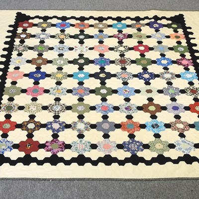 Lot 323 - A patchwork quilt