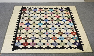 Lot 323 - A patchwork quilt