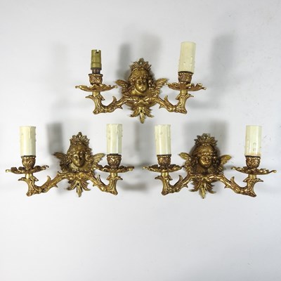 Lot 212 - A set of three Rococo style gilt metal wall lights