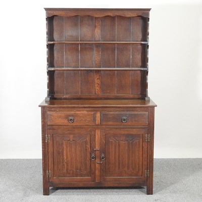 Lot 405 - An Ercol style dresser