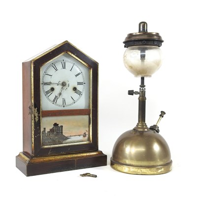 Lot 235 - A clock and lamp