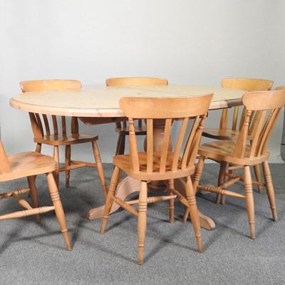 Lot 238 - A pine table and chairs