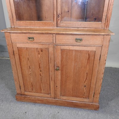 Lot 72 - An antique pine glazed cabinet