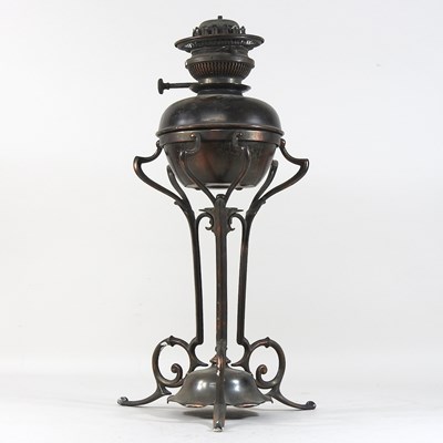 Lot 225 - An Arts and Crafts bronzed oil lamp