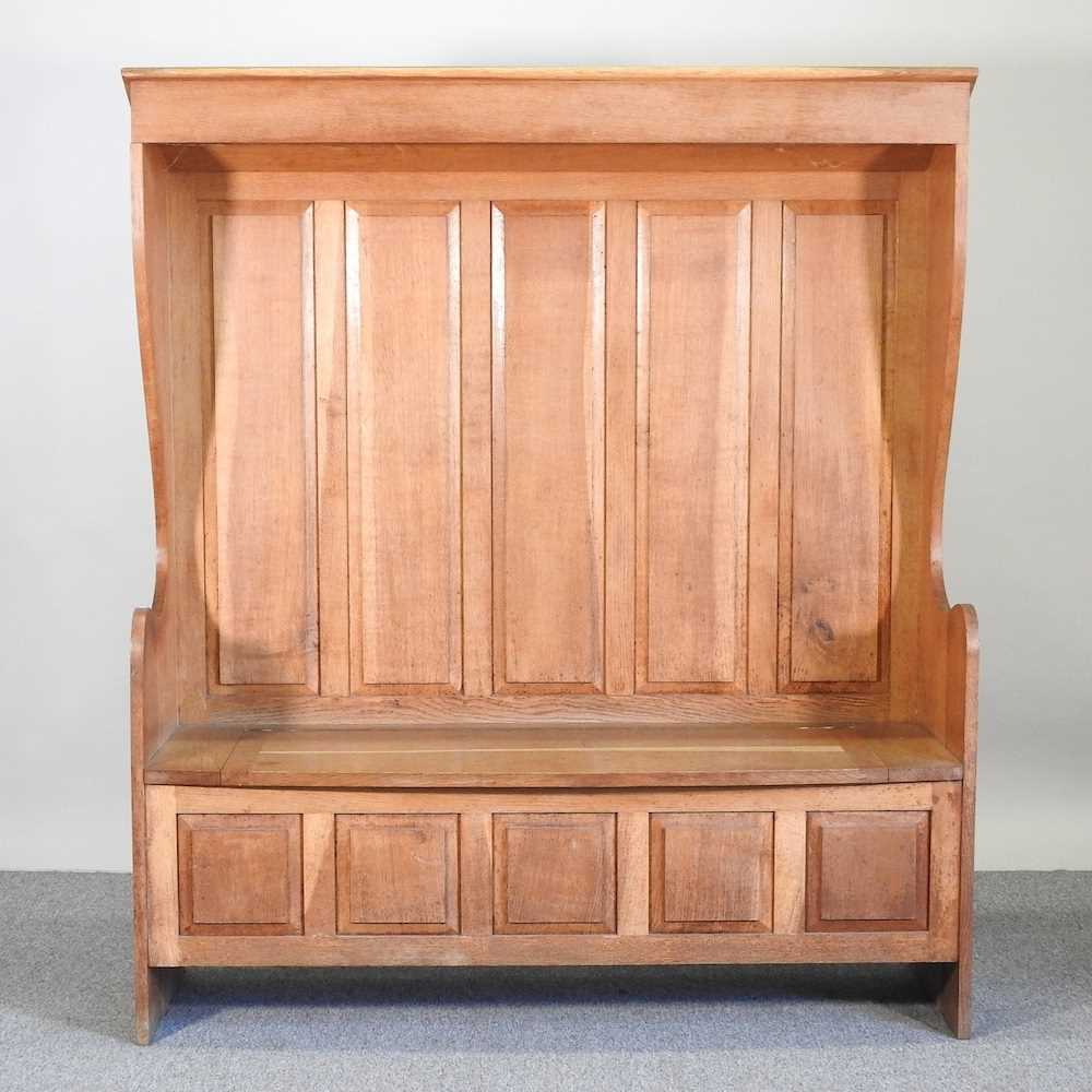 Lot 63 - An oak settle