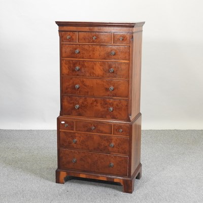 Lot 623 - A mid 20th century yew wood chest on chest