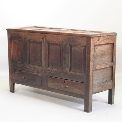 Lot 124 - An 18th century panelled oak mule chest