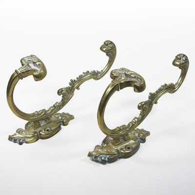 Lot 127 - A pair of 19th century ornate brass wig hooks