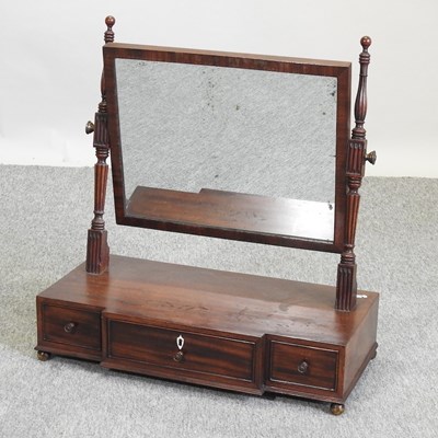 Lot 601 - A George III mahogany swing frame toiletry mirror