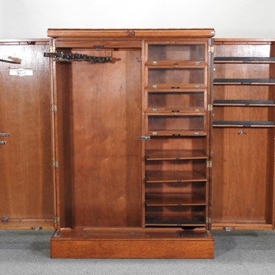 Lot 671 - A 1920's Compactum oak wardrobe