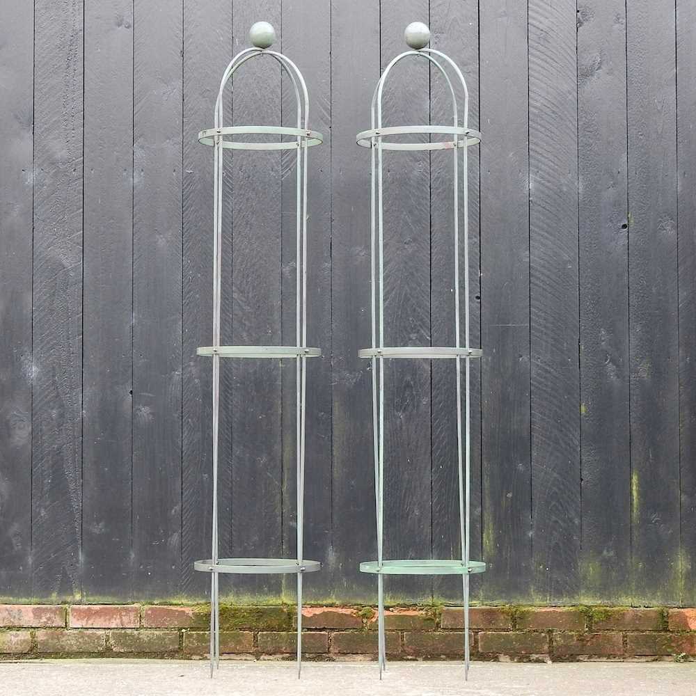 Lot 302 - A pair of metal garden obelisks