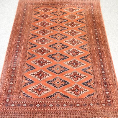 Lot 259 - A woollen carpet