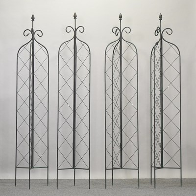 Lot 347 - A set of four metal folding lattice garden spires