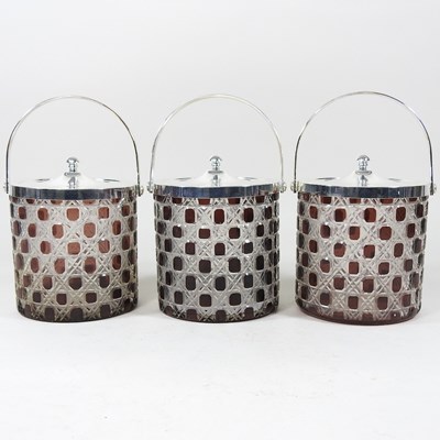 Lot 463 - A set of three modern glass biscuit barrels.