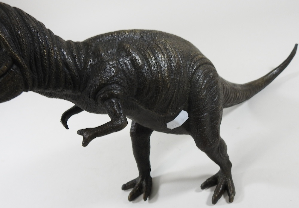 Lot 384 - A bronze dinosaur