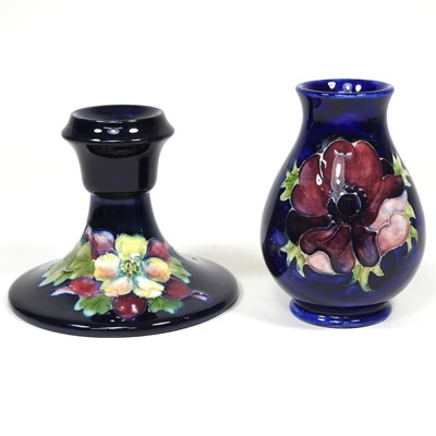 Lot 101 - A Moorcroft pottery candlestick and vase