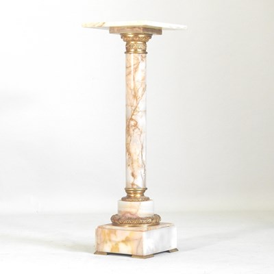Lot 123 - A marble and brass mounted jardiniere stand