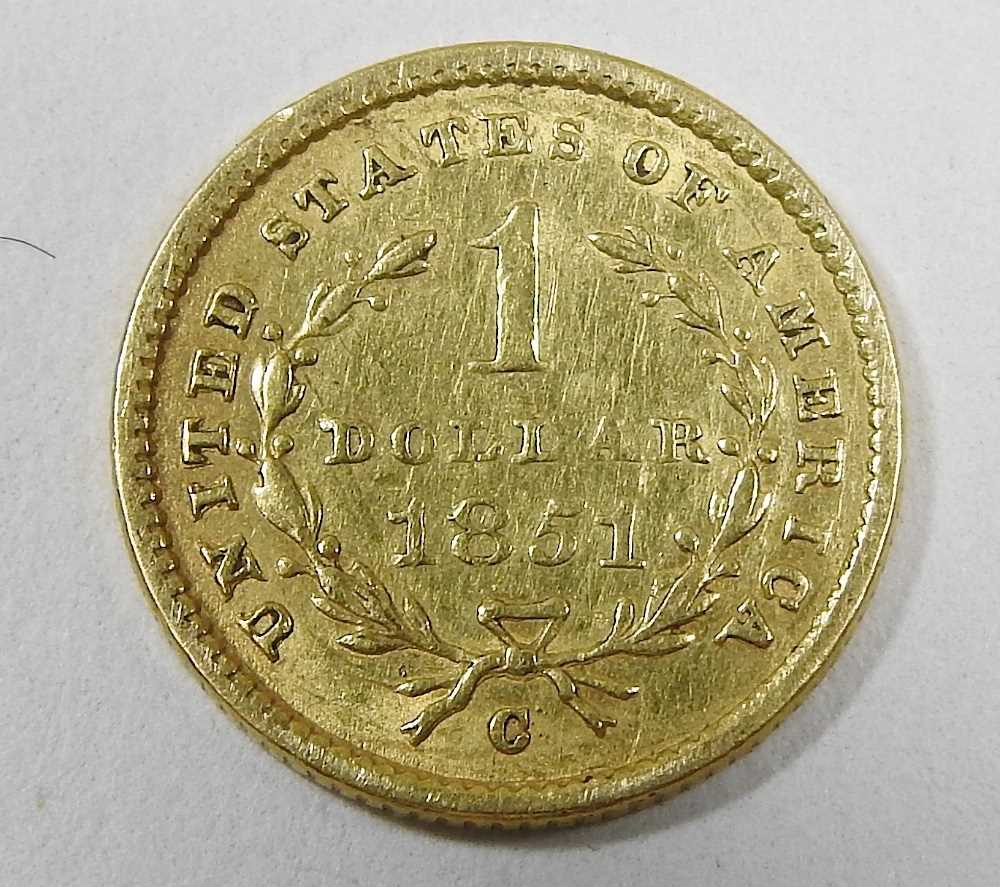 Lot 18 A gold dollar coin