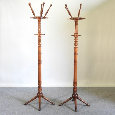 Lot 99 - A pair of Edwardian walnut hat stands