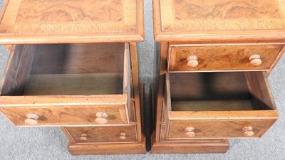 Lot 72 - A pair of walnut bedside chests