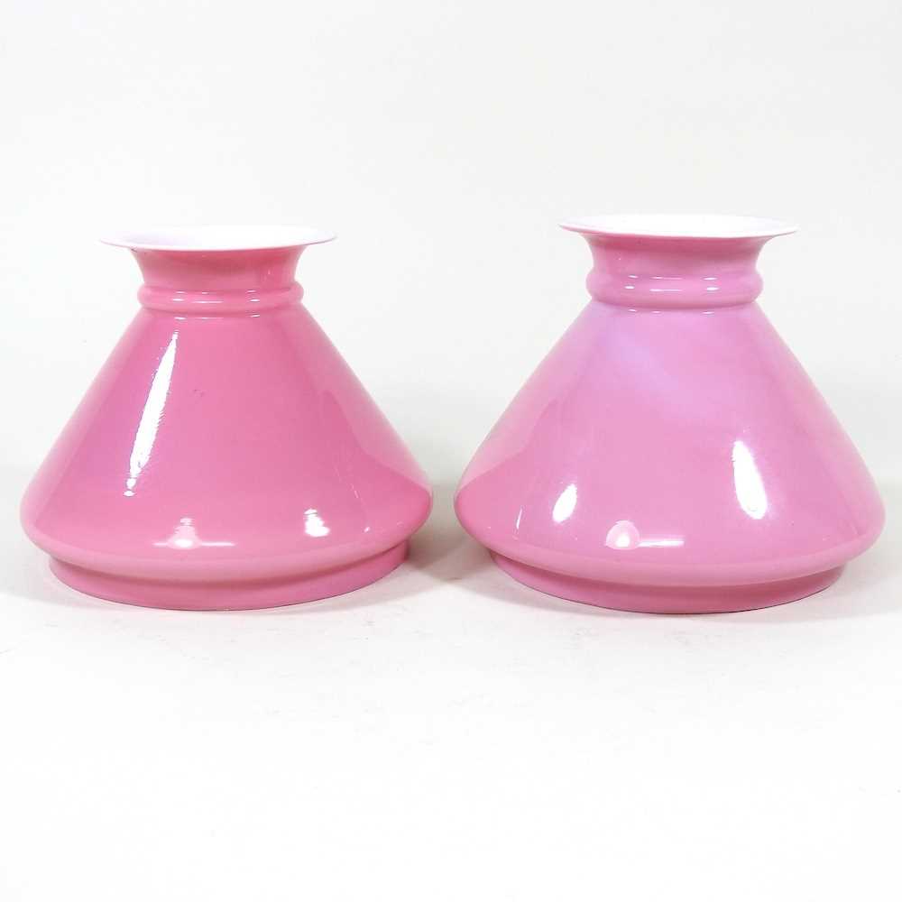 Lot 405 - A near pair of pink glass peg oil lamp shades