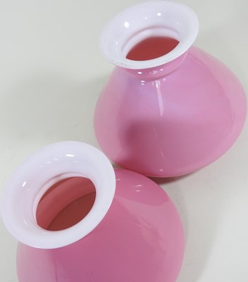 Lot 405 - A near pair of pink glass peg oil lamp shades