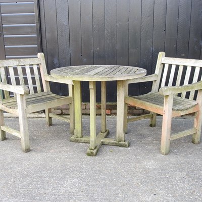 Lot 670 - A garden table and chairs